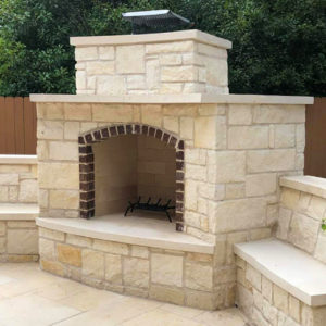 limestone and brick fireplace
